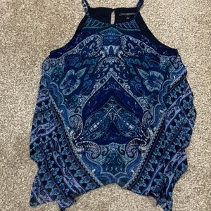 Coco Bianco sleeveless top size Medium with handkerchief style bottom.